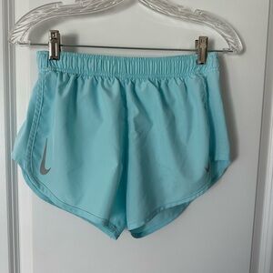 Nike light blue running short dolphin hem size small